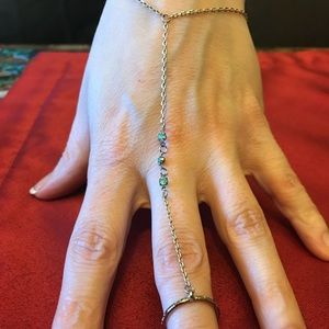 Green jeweled golden hand jewelry